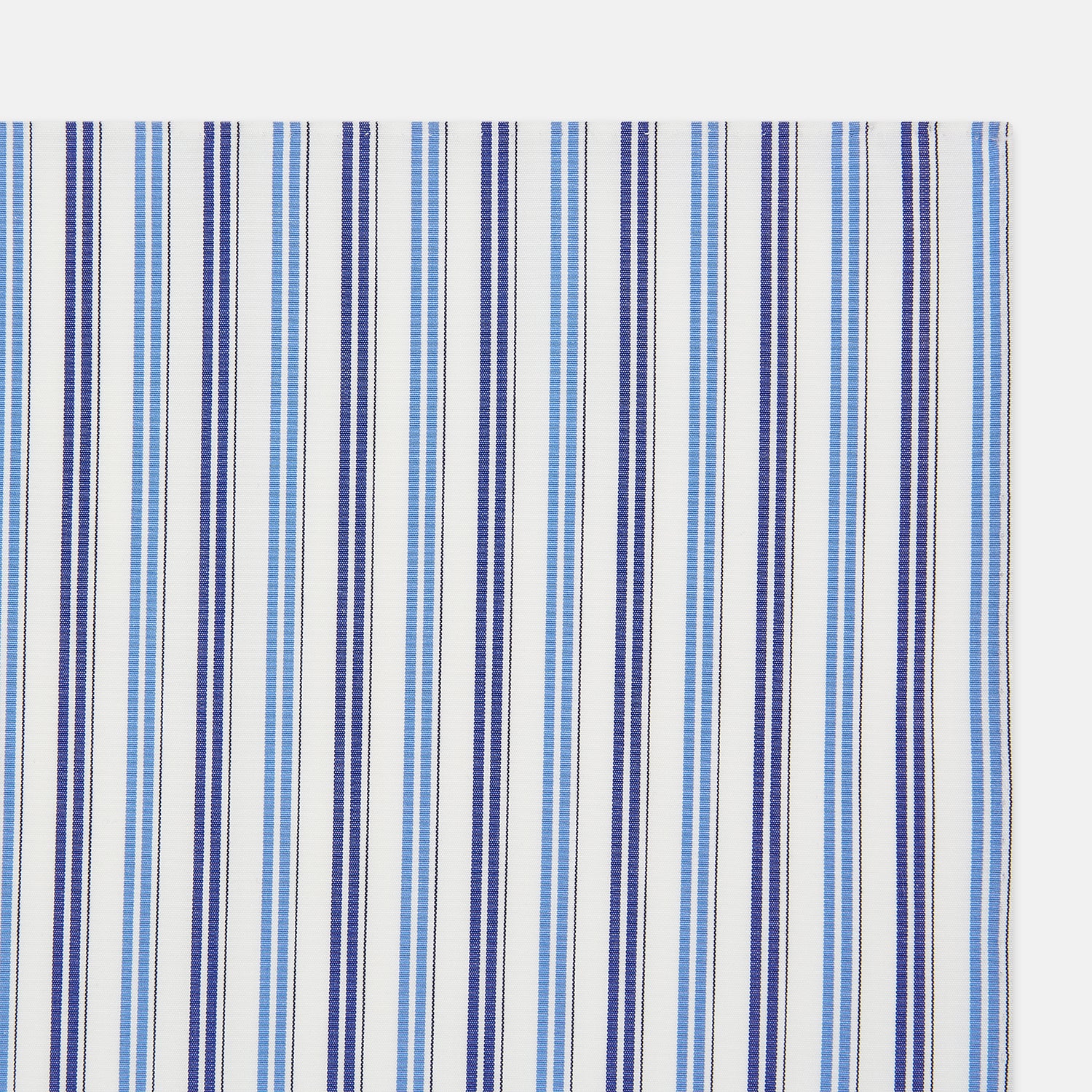 View 2 of product The Blue and Navy Multi Stripe Hand-Rolled Handkerchief by Turnbull & Asser is crafted in England with a white background and evenly spaced vertical stripes in blue and navy.