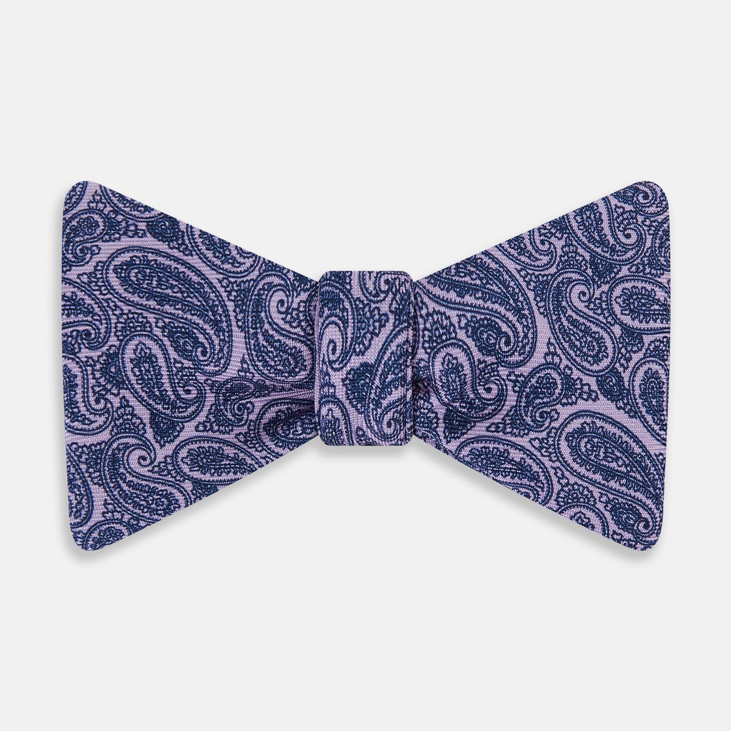 View 1 of product The Turnbull & Asser Lilac Paisley Silk Bow Tie features a refined dark blue pattern on lilac silk, shown on a plain white background—an elegant men's accessory for any occasion.