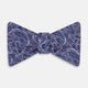 The Turnbull & Asser Lilac Paisley Silk Bow Tie features a refined dark blue pattern on lilac silk, shown on a plain white background—an elegant men's accessory for any occasion.