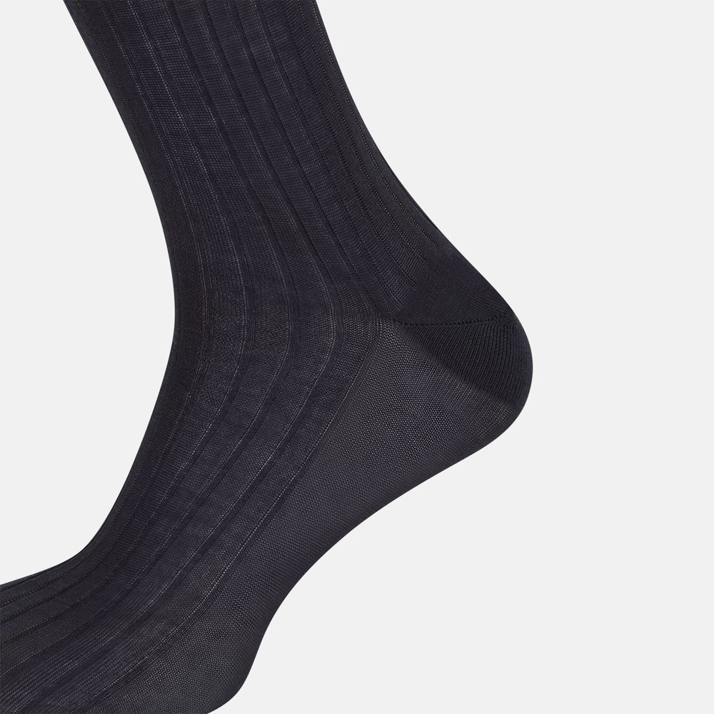 The Turnbull & Asser Smoke Mid-Length Sock, in black with a ribbed design, is displayed upright on a white background to highlight its refined comfort and coverage from toe to cuff.