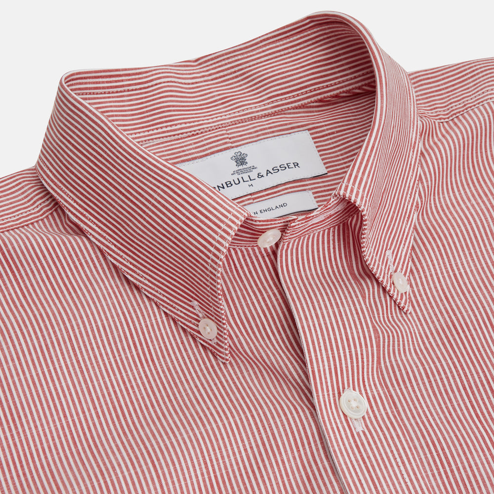 The Turnbull & Asser Dark Red Chambray Stripe Weekend Fit Shirt with a Dorset collar features striped cotton, two chest pockets with button flaps, and white front and cuff buttons—perfect for a relaxed yet stylish weekend look.