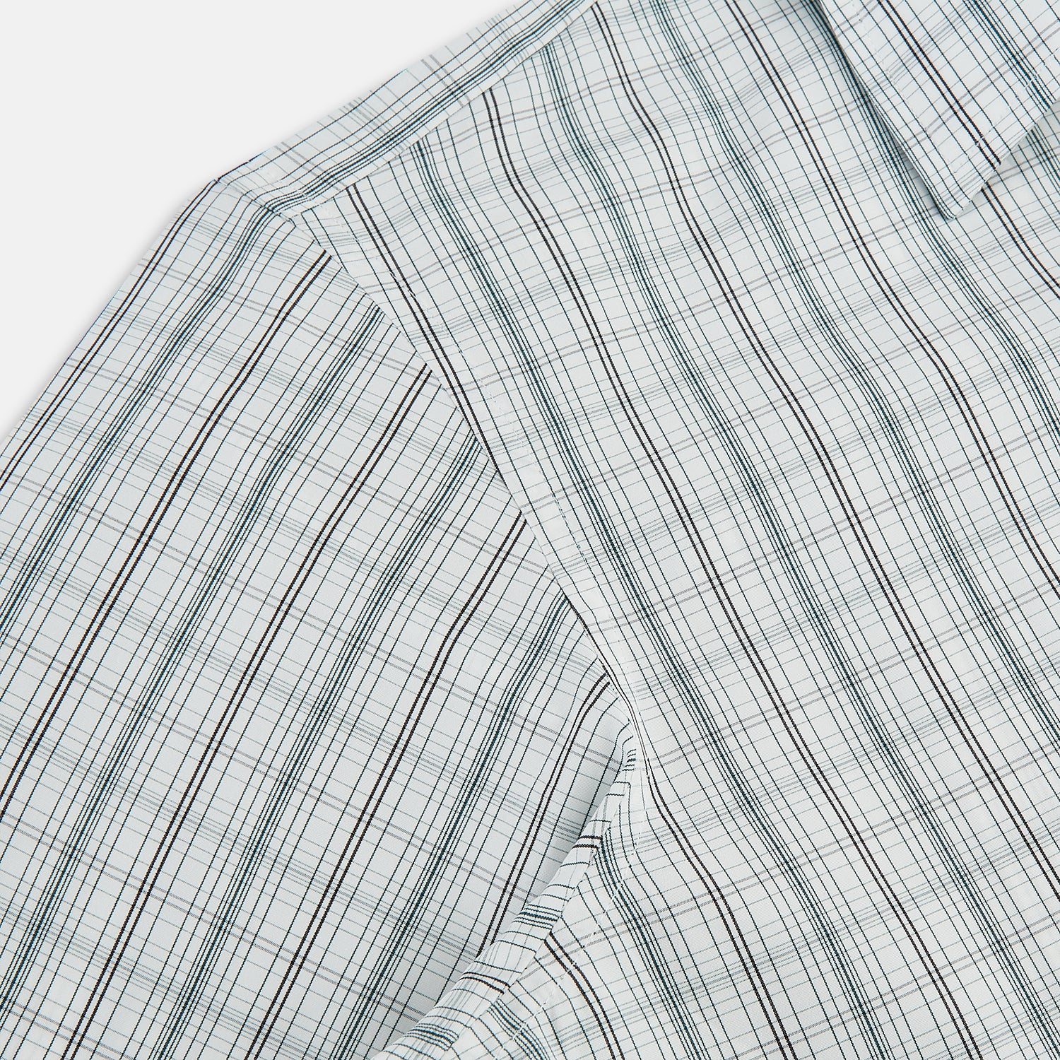 View 6 of product The Turnbull & Asser Forest Green Multi Check Westminster Shirt is a tailored, long-sleeved, button-up shirt with a collar and a white base featuring light blue and green plaid, displayed flat on a white background.