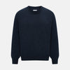 View 1 of product The Turnbull & Asser Midnight Blue Cashmere Round Neck Jumper, featuring long sleeves and ribbed trims, is shown against a light grey background.