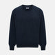 The Turnbull & Asser Midnight Blue Cashmere Round Neck Jumper, featuring long sleeves and ribbed trims, is shown against a light grey background.