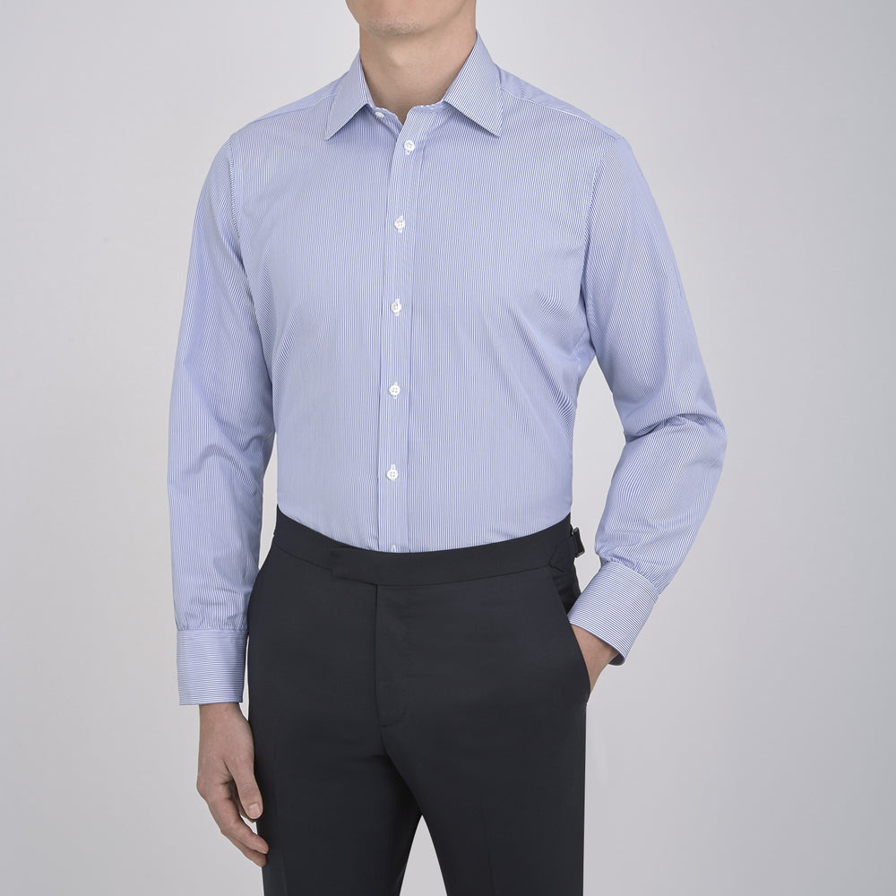 The Turnbull & Asser Blue Fine Bengal Stripe Shirt features a classic T&A collar, 3-button cuffs, and white buttons, crafted from fine cotton and displayed against a crisp white background.