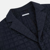 View 2 of product The Fulham Navy Single-Breasted Quilted Blazer by Turnbull & Asser features a notched lapel, three black buttons, a chest pocket, and two front flap pockets. Shown on a plain white background—ideal for the modern gentleman.