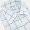 View 2 of product The Turnbull & Asser Sage Grid Check Mayfair Shirt is a white, long-sleeve shirt made from Italian cotton with a light blue and sage grid pattern, shown neatly laid flat on a plain, light background.