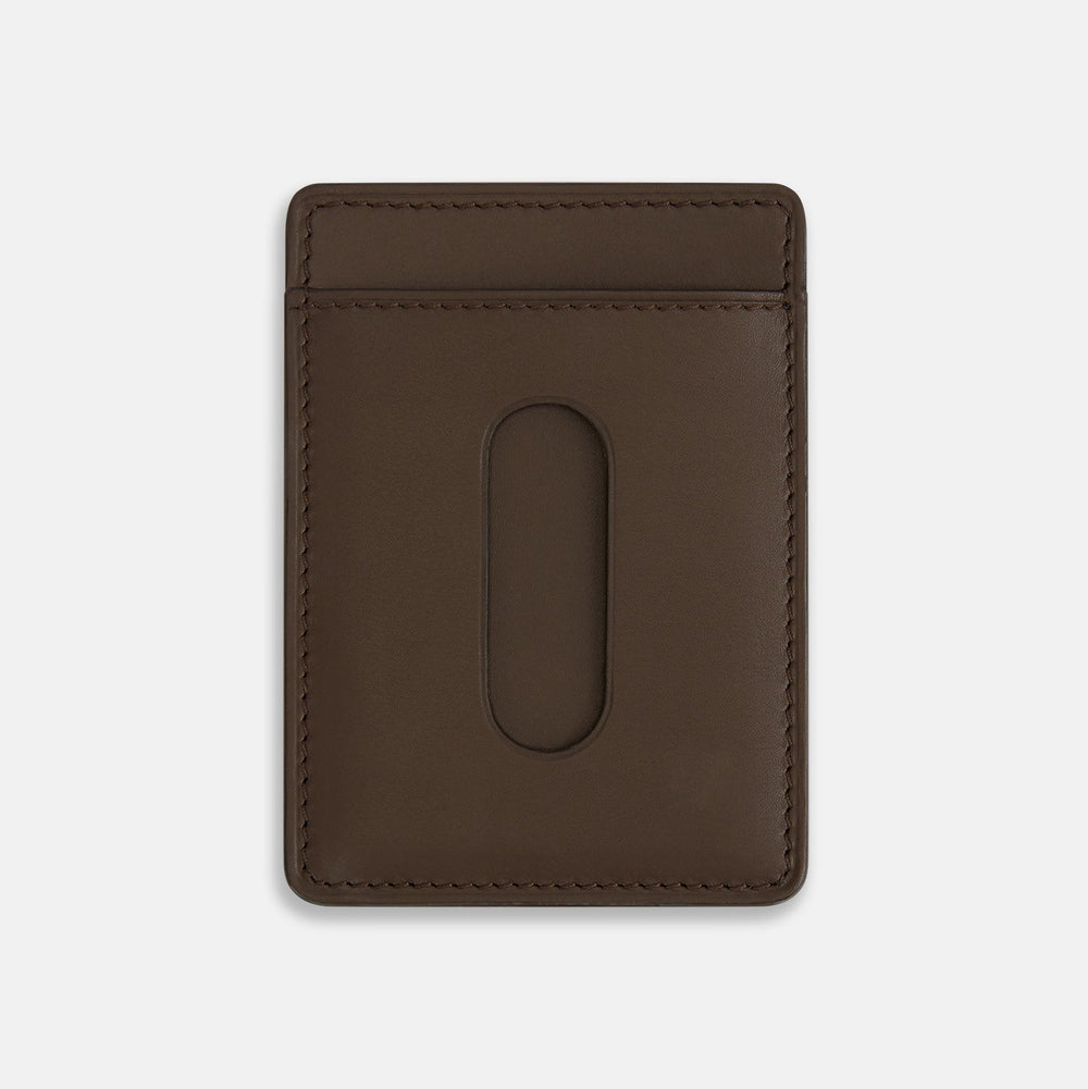 The Dark Chocolate Two-slot Card Case by Turnbull & Asser features slim Italian leather, subtle stitching, and white embossed branding at the bottom center—a refined minimalist accessory on a plain white background.