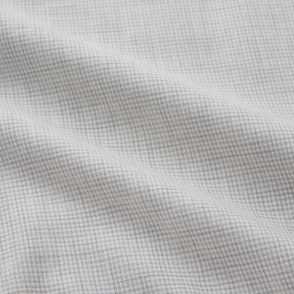 A Grey Fine Check Cotton Blend Weekend Fit Suffolk Shirt by Turnbull & Asser with long sleeves, a collar, and single chest pocket is laid flat on a white background.