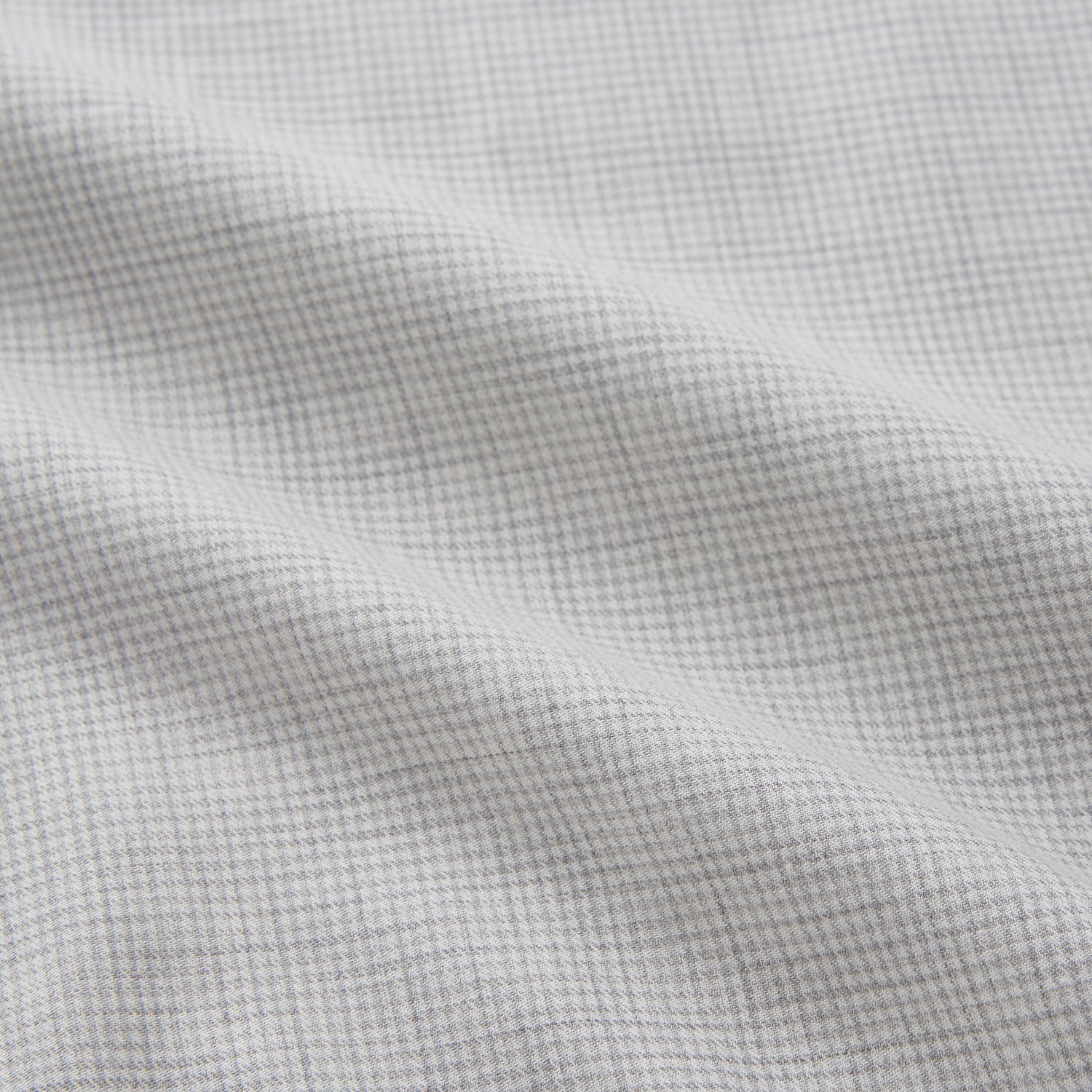 View 2 of product A Grey Fine Check Cotton Blend Weekend Fit Suffolk Shirt by Turnbull & Asser with long sleeves, a collar, and single chest pocket is laid flat on a white background.