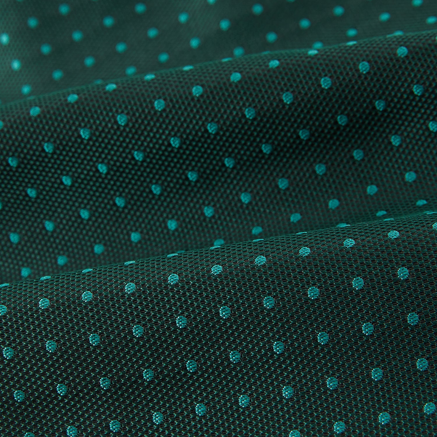 View 4 of product The Turnbull & Asser Blue and Forest Green Micro Dot Silk Cravat pairs perfectly with a dark green pocket square featuring light blue micro dots, ideal for formal looks or adding distinction to your ensemble.