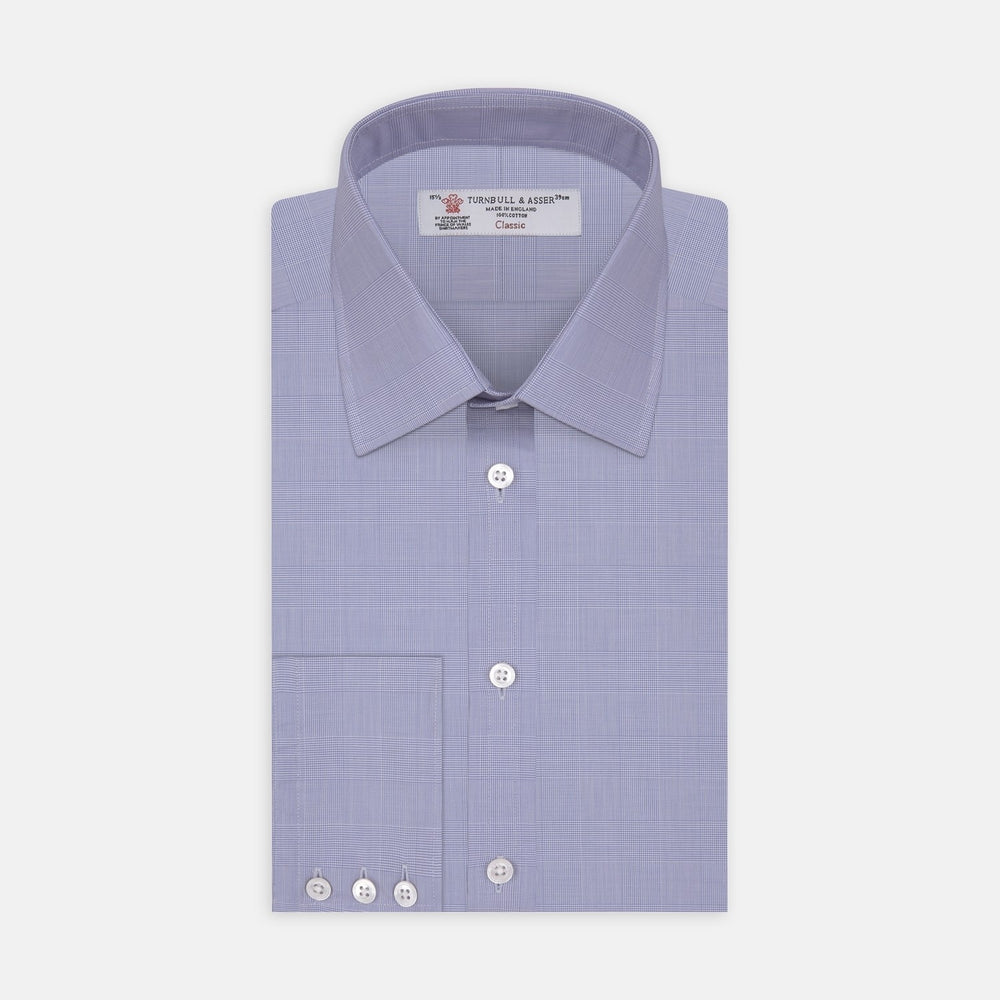 Turnbull & Asser's Blue Prince of Wales Check Cotton Fabric features a circular blue and white Glen plaid design with a gray border on a white background.