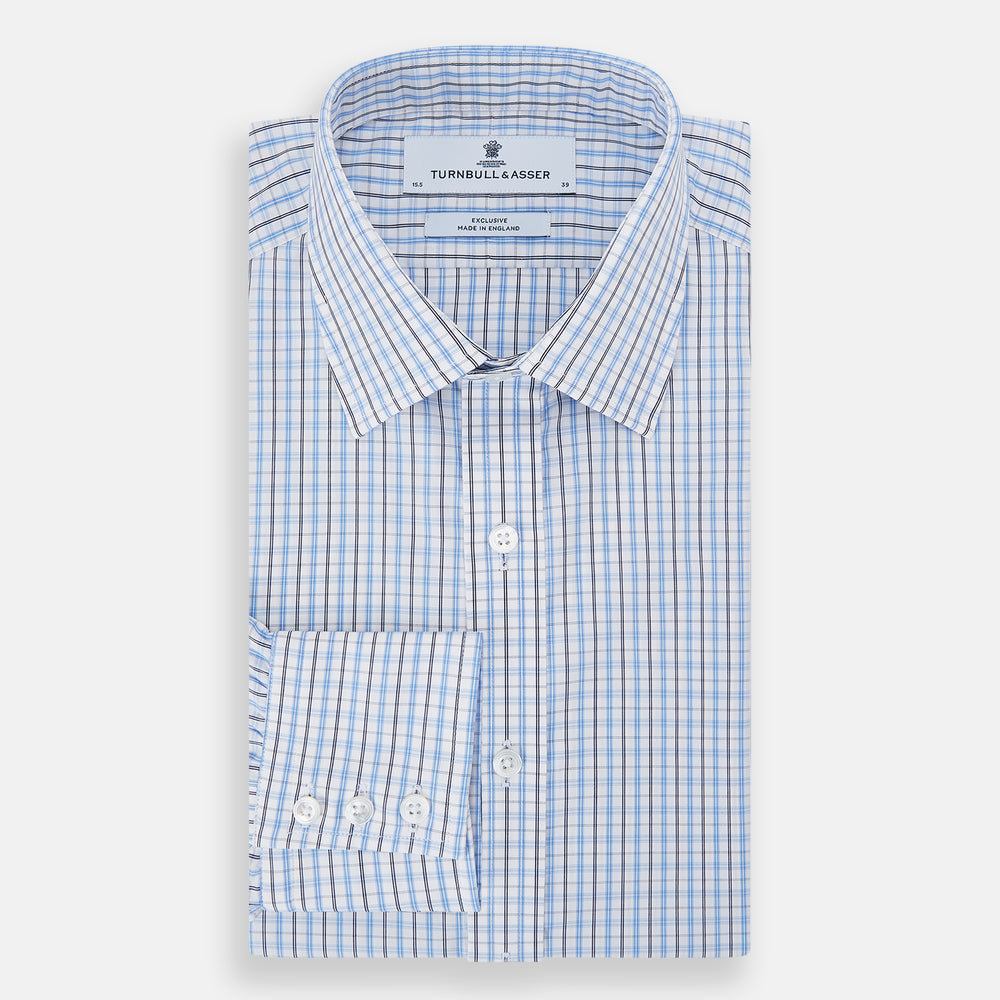 The Turnbull & Asser Navy and Blue Multi Check Mayfair Shirt features a crisp blue and navy check pattern, T&A collar, long sleeves, and a tailored Mayfair fit.
