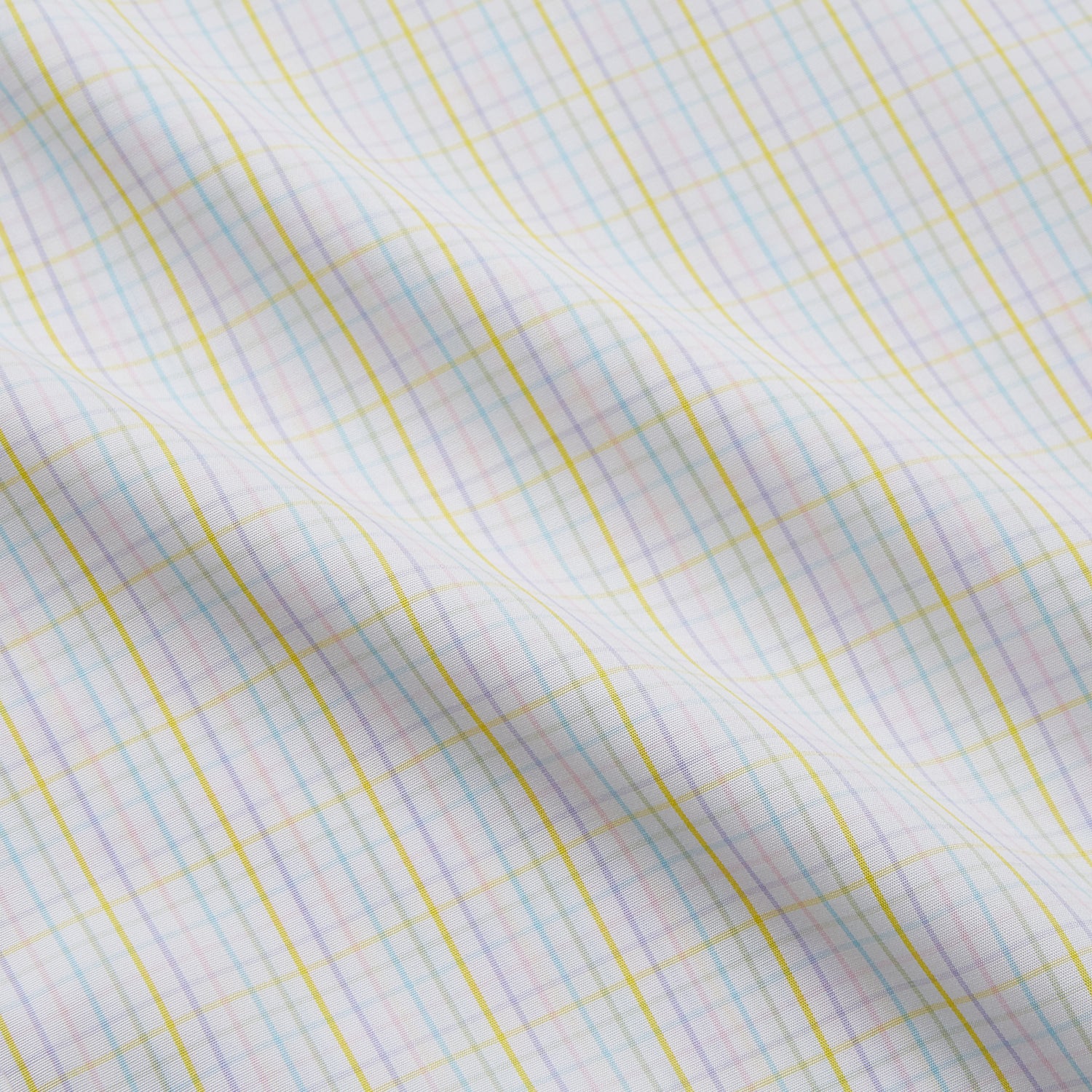 View 4 of product The Turnbull & Asser Yellow Multi Check Cotton Regular Fit Mayfair Shirt features a long-sleeved, button-up design with yellow and blue plaid, pointed collar, and buttoned cuffs, laid flat on a white background.