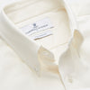 View 3 of product The Turnbull & Asser Cream Weekend Fit Hayne Shirt features a Dorset collar and 1-button cuffs, displayed long-sleeved and laid flat on a white background.