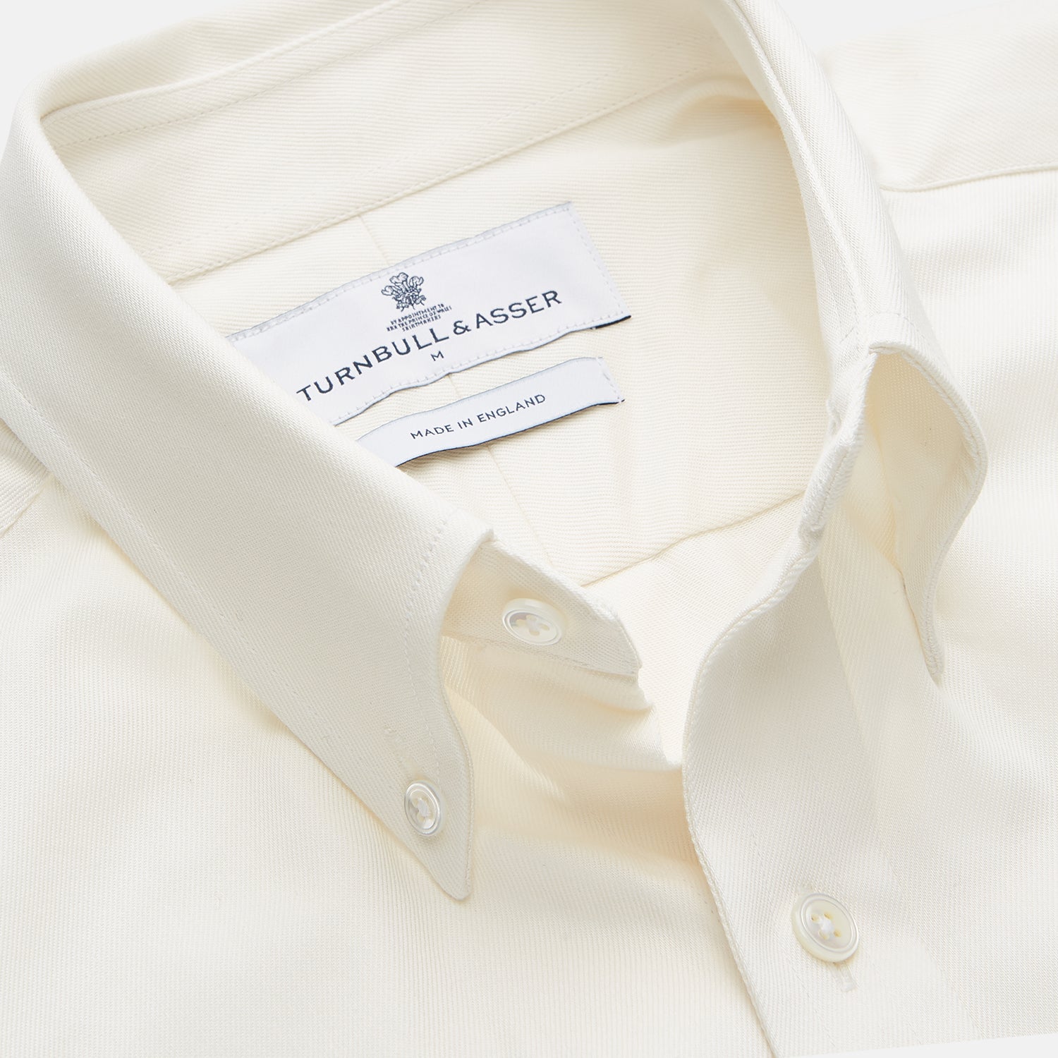 View 3 of product The Turnbull & Asser Cream Weekend Fit Hayne Shirt features a Dorset collar and 1-button cuffs, displayed long-sleeved and laid flat on a white background.