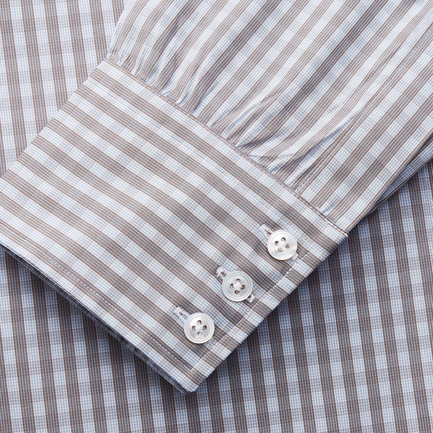 View 3 of product The Turnbull & Asser Pale Blue Multi Check Cotton Regular Fit Mayfair Shirt features a pale blue checkered pattern and long sleeves, shown on a white background.