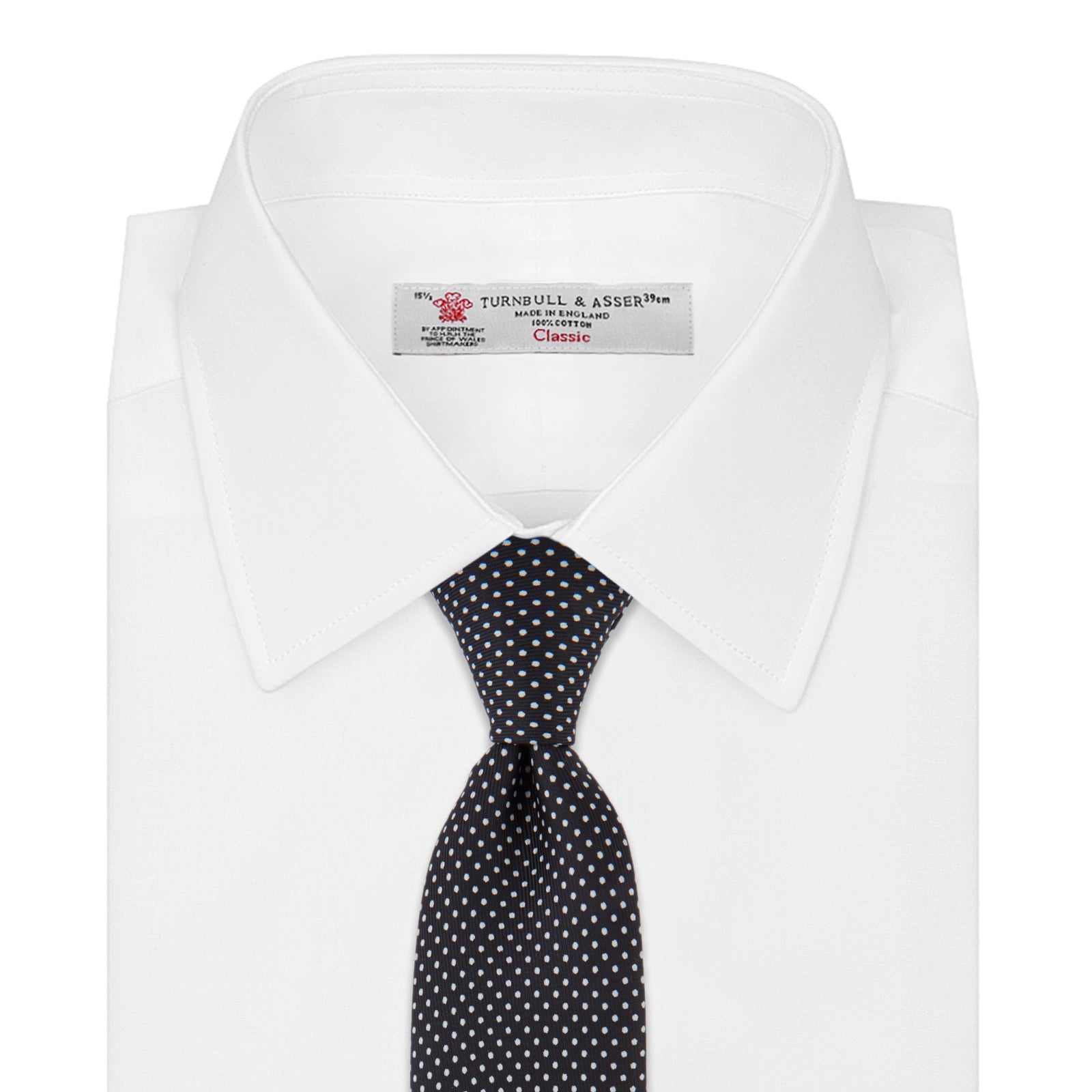 View 2 of product The Turnbull & Asser Black and White Small Spot Printed Silk Tie, shown rolled against a white background, features a subtle polka dot pattern—an ideal accessory for any office shirt.