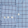 View 4 of product The Turnbull & Asser Blue and Navy Windowpane Mayfair Shirt features long sleeves, a T&A collar, buttoned cuffs, and Italian cotton in a blue and navy windowpane pattern, shown on a plain white background.