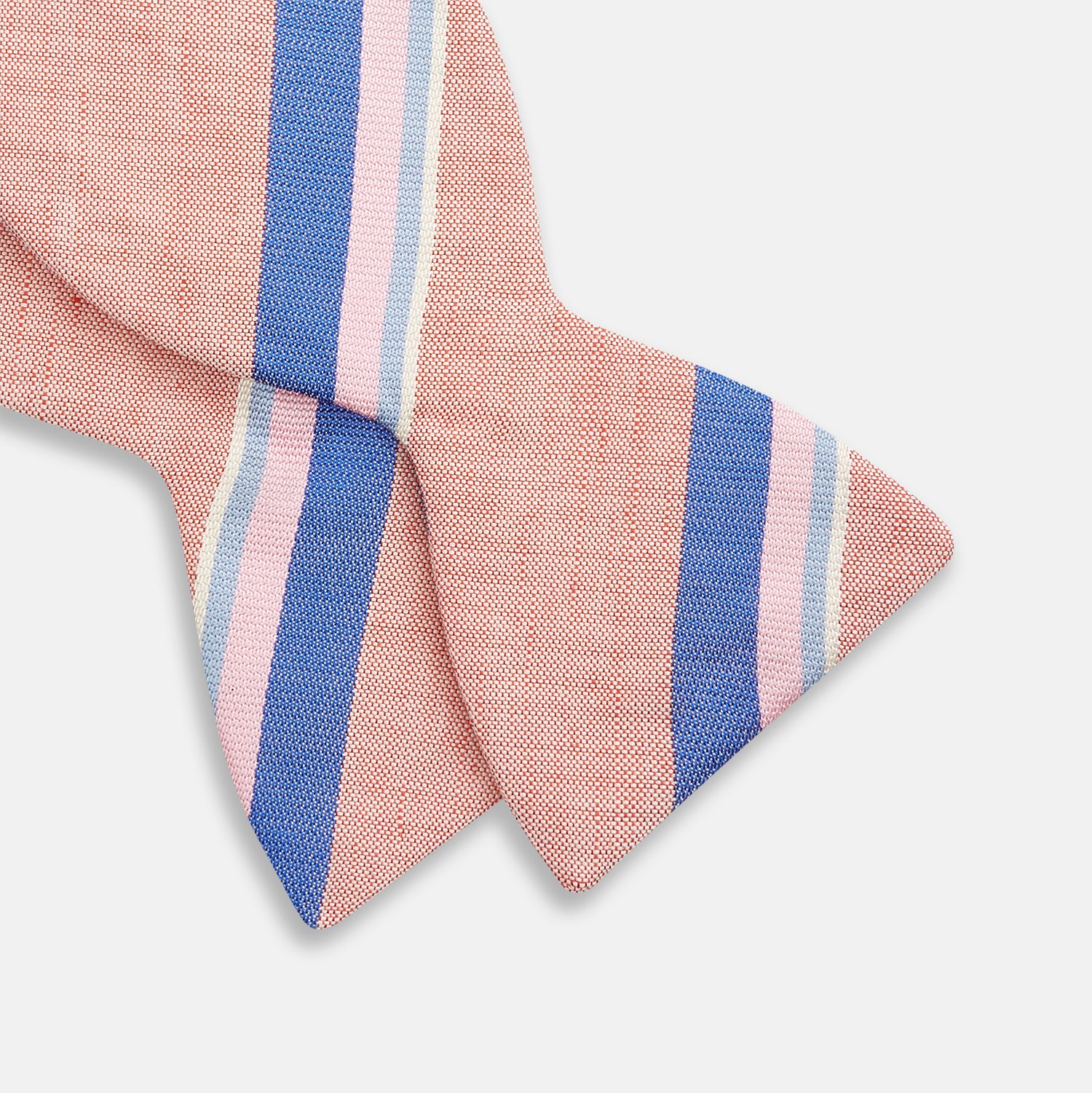 View 3 of product The Thistle-Petersham-Double End Bow Tie by Turnbull & Asser features a pink base with diagonal blue, white, and navy stripes—a versatile accessory perfect for any gentleman's wardrobe.