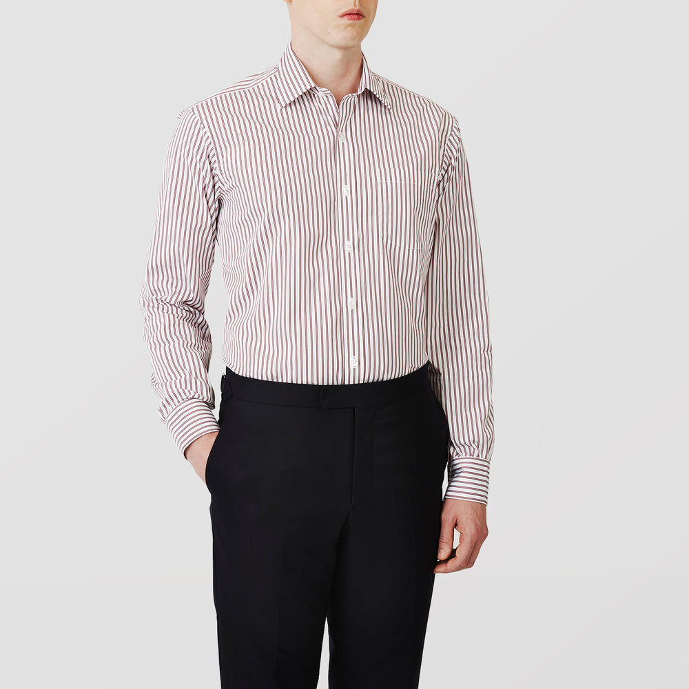The Turnbull & Asser Burgundy Stripe Weekend Fit Shirt features a Derby collar, 1-button cuffs, and vertical burgundy and white stripes, shown laid flat on a plain light background.