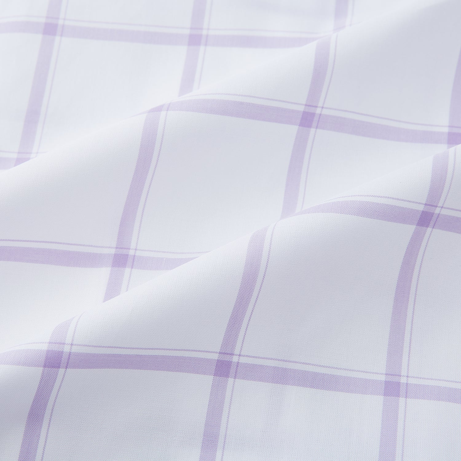View 6 of product The Turnbull & Asser Lilac Grid Check Mayfair Shirt is a long-sleeve, button-up style crafted from Italian cotton with a white base and lilac grid check pattern, shown on a plain white background.