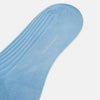 View 3 of product A single Turnbull & Asser Pale Blue Long Sock, featuring a ribbed texture and crafted from mercerised Egyptian cotton, is displayed upright on a plain white background.