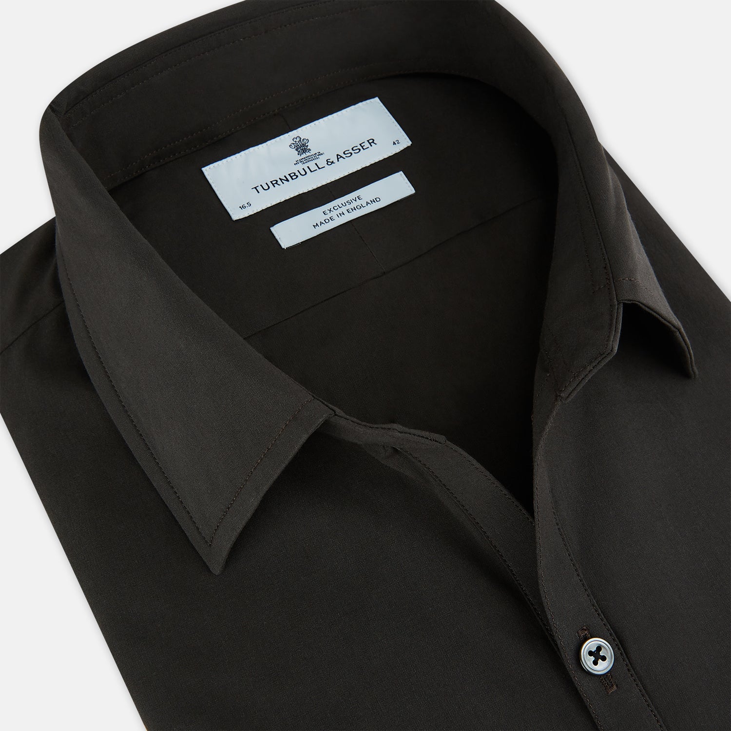 View 2 of product A brown Windsor long-sleeve button-up shirt by Turnbull & Asser with a classic collar, buttoned cuffs, and a straight hem, laid flat on a white background—showcasing refined British craftsmanship.