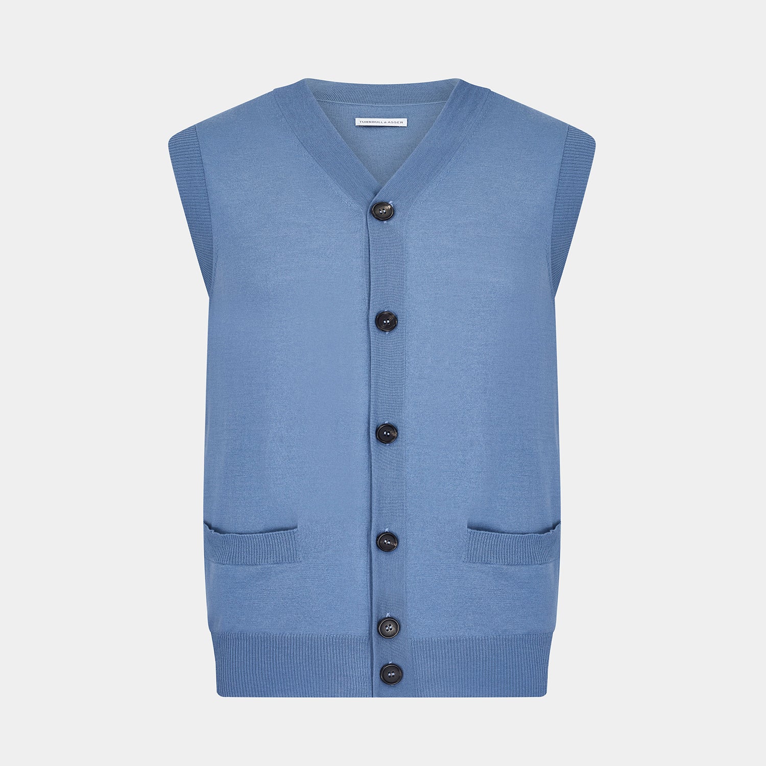 View 1 of product Turnbull & Asser’s Pale Blue Merino V-neck Sleeveless Cardigan features a button-up front, two pockets, and ribbed hem—a classic gentleman’s piece shown on a plain white background.