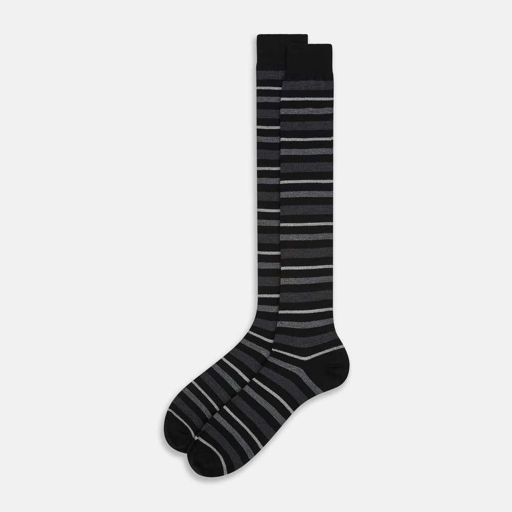 The Turnbull & Asser Chocolate Melange Striped Merino Wool Long Sock features black, dark gray, and light gray horizontal stripes and is displayed individually on a white background.