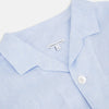 View 2 of product The Turnbull & Asser Pale Blue Linen Pyjama Shirt features long sleeves, a collar, front buttons, and a chest pocket—perfect as elegant loungewear or nightwear.