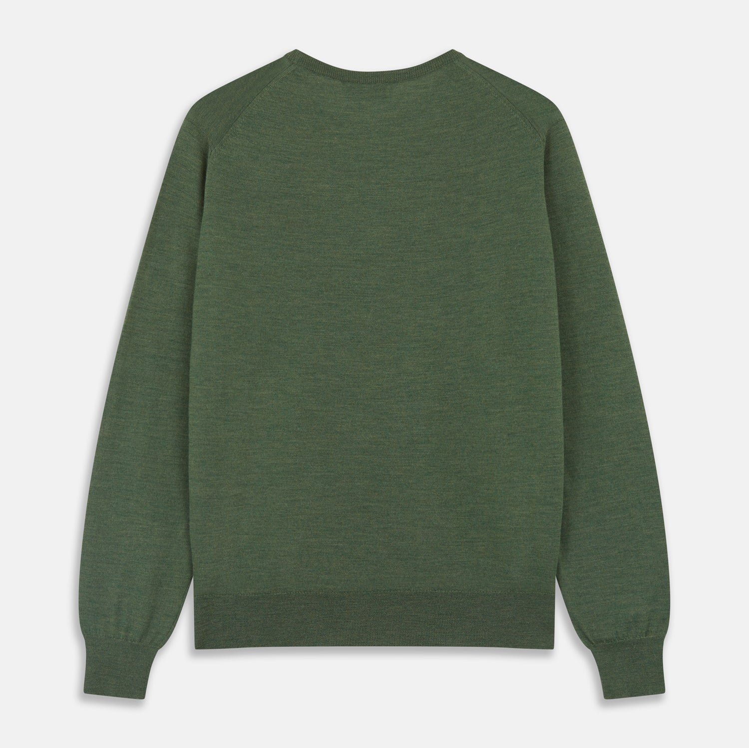 View 5 of product A man stands facing the camera against a plain light background, wearing the Turnbull & Asser Bottle Green Merino Kingston Crew Neck Jumper with dark pants and black shoes. His arms rest at his sides and he has a neutral expression.