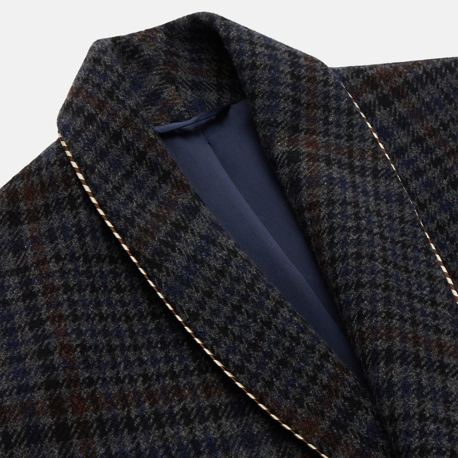 View 3 of product The Turnbull & Asser Charcoal Grey Check Wool Pierce Gown features a long, gown-style silhouette with a shawl collar, wrap-around belt, cuffed sleeves, and white edge stitching, shown against a plain white background.
