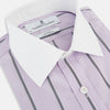 View 2 of product The Turnbull & Asser Lilac Track Stripe Shirt with Contrast T&A Collar and Cuffs features vertical black stripes, a white pointed collar, and white cuffs, shown flat against a white background.