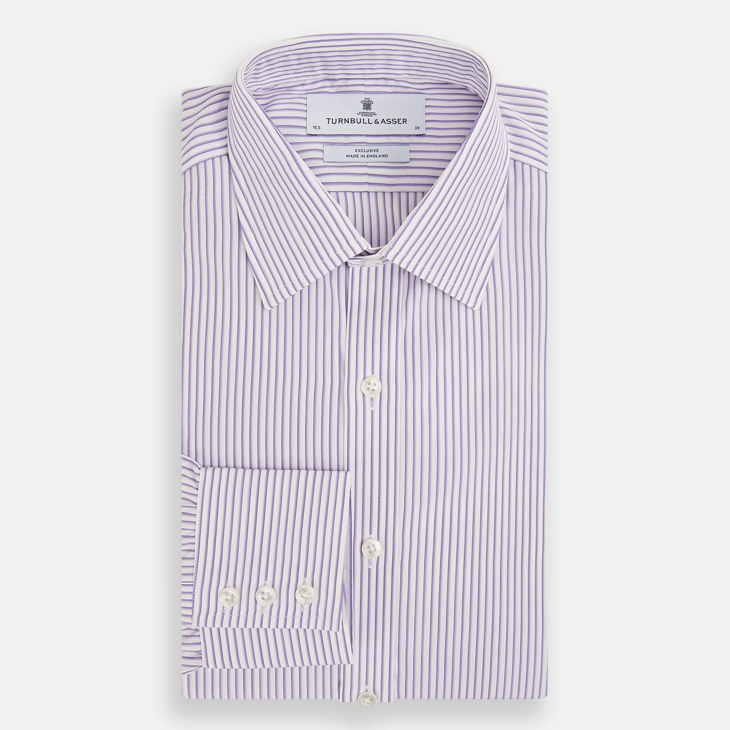 View 5 of product The Turnbull & Asser Purple Shadow Stripe Mayfair Shirt features a long-sleeve button-up design with thin vertical blue and white stripes, a T&A collar, and buttoned cuffs, shown on a plain white background.