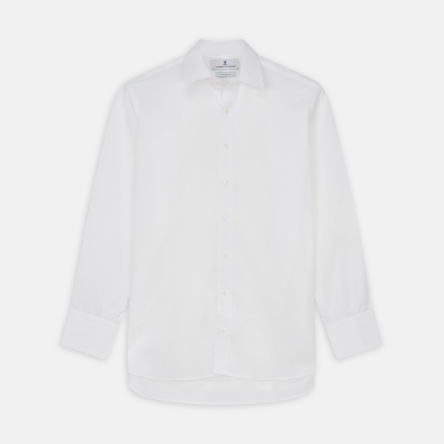 View 1 of product The Turnbull & Asser White Cotton Voile Regular Fit Mayfair Shirt features long sleeves, a pointed collar, button-down front, and buttoned cuffs, displayed flat against a plain white background.