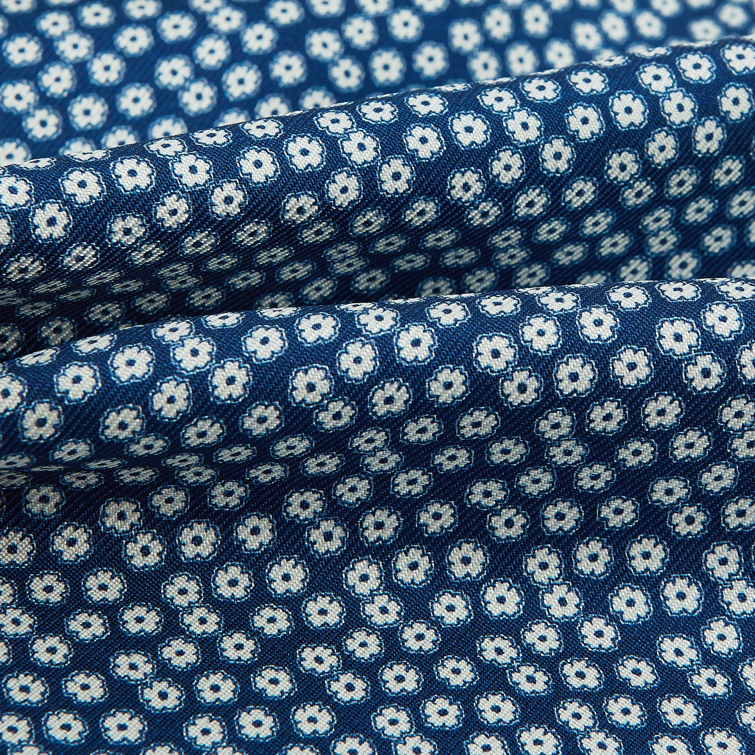 View 4 of product The Azzurro Flower Patterned Silk Cravat by Turnbull & Asser features a classic blue design with small white flowers—a refined British-inspired accessory.