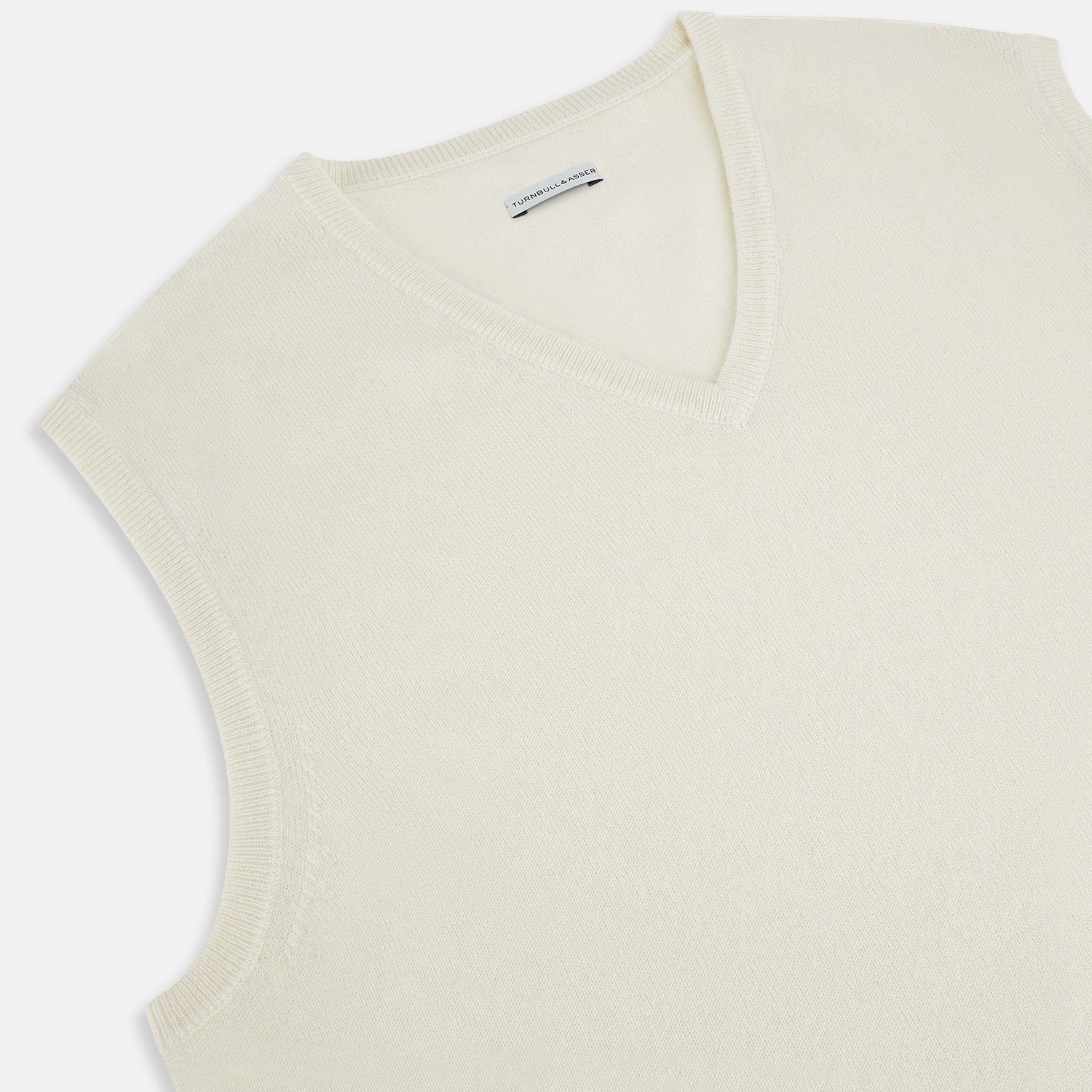 View 2 of product The Turnbull & Asser Ivory Cashmere V-neck Vest is a sleeveless, sophisticated knit pullover shown against a plain white background.