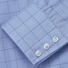 View 4 of product The Blue Prince of Wales Check Mayfair Shirt by Turnbull & Asser is a light blue formal long-sleeve shirt with a subtle check pattern, button-down front, and buttoned cuffs, shown laid flat on a white background.