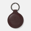 View 1 of product A burgundy leather fob holder by Turnbull & Asser, embossed with the brand name and Made in England, features a metal split keyring at the top.