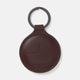 A burgundy leather fob holder by Turnbull & Asser, embossed with the brand name and Made in England, features a metal split keyring at the top.