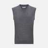 View 1 of product The Turnbull & Asser Slate Grey Melange V-neck Cashmere Vest is a plain, sleeveless jumper shown against a white background.