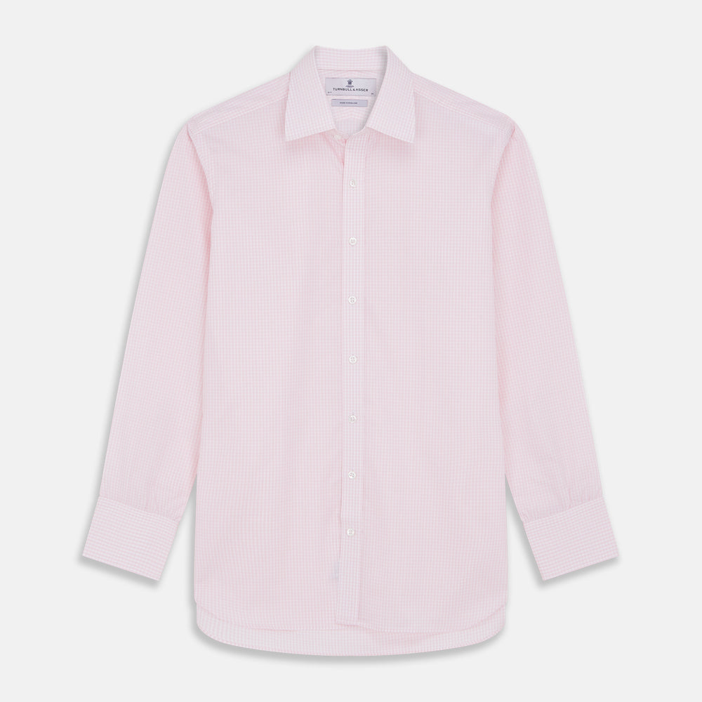 The Pink Windowpane Check Mayfair Shirt by Turnbull & Asser features a light pink, long-sleeve design with subtle windowpane checks, button-down front, and soft organic cotton, shown against a white background.