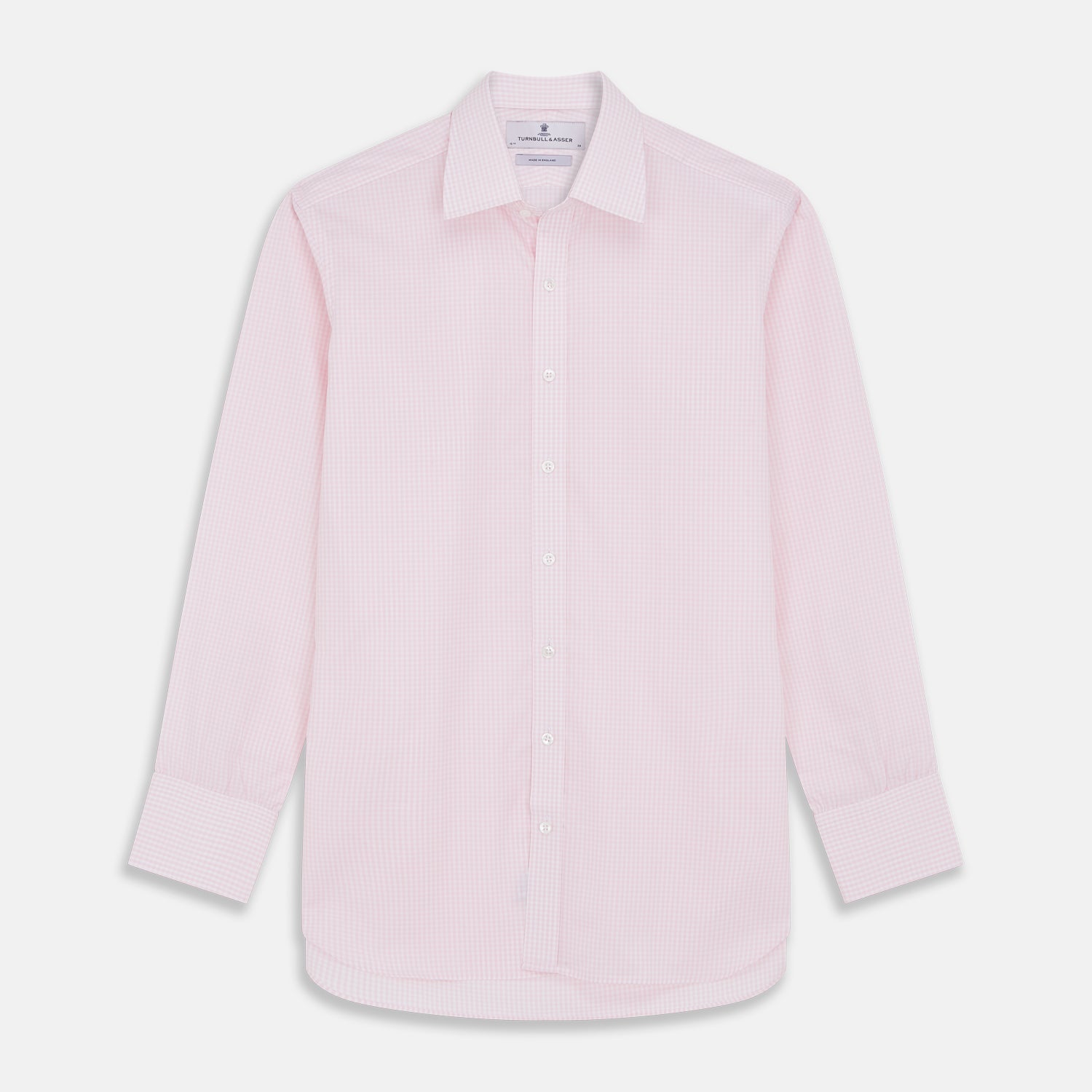 View 1 of product The Pink Windowpane Check Mayfair Shirt by Turnbull & Asser features a light pink, long-sleeve design with subtle windowpane checks, button-down front, and soft organic cotton, shown against a white background.