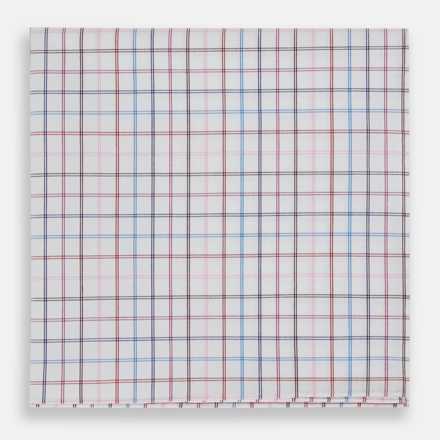 View 1 of product The Turnbull & Asser Hand Rolled Multi Graph Check Handkerchief features a white cotton base with thin red, blue, and purple intersecting lines forming a check pattern, neatly folded with stitched edges for an elegant gentleman's accessory.