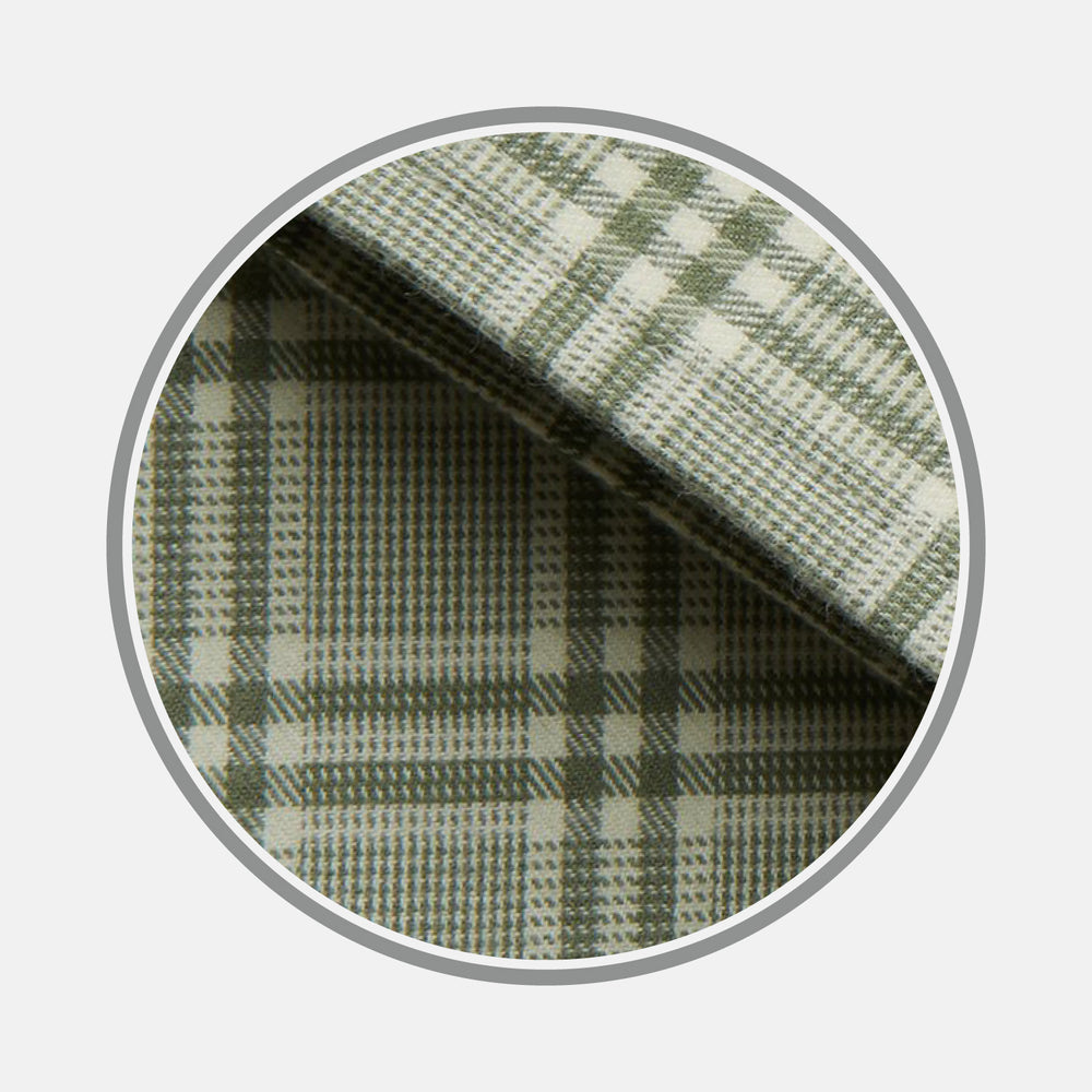 Close-up of Turnbull & Asser's Green Check Cotton Fabric with intersecting green and white lines and squares, displayed within a circular frame against a light gray background.
