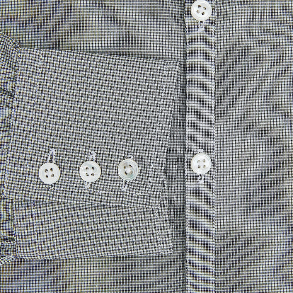The Turnbull & Asser Grey and White Micro Check Westminster Shirt features long sleeves, a button-up front, a Westminster collar, and white buttons, shown flat on a white background.
