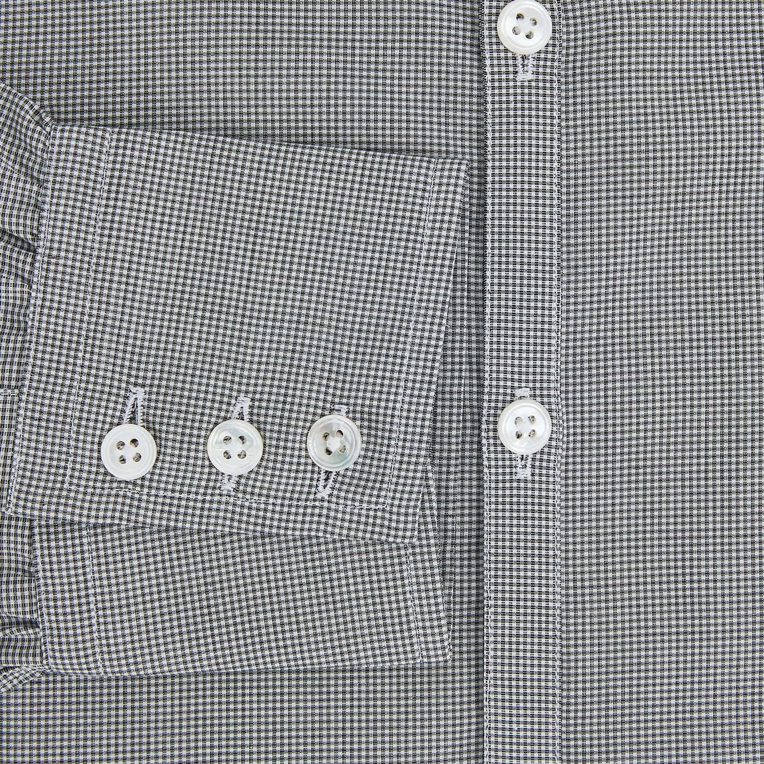 View 4 of product The Turnbull & Asser Grey and White Micro Check Westminster Shirt features long sleeves, a button-up front, a Westminster collar, and white buttons, shown flat on a white background.