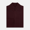 View 4 of product The Turnbull & Asser Burgundy Merino High Neck Zipped Cardigan features long sleeves, a zip-up front, and ribbed collar, cuffs, and hem, crafted from soft merino knitwear and shown on a white background.