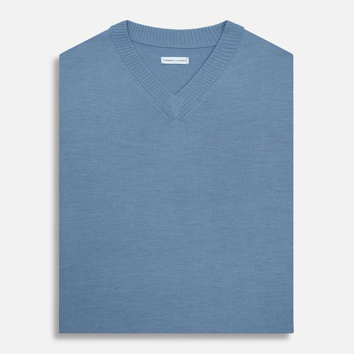 View 4 of product The Turnbull & Asser Pale Blue Fine Merino V-Neck Vest features a sleeveless design, knit texture, and classic V-neckline, shown against a plain white background.